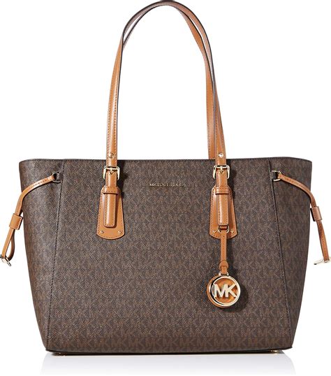 michael kors bags for women price|Michael Kors woman with bag.